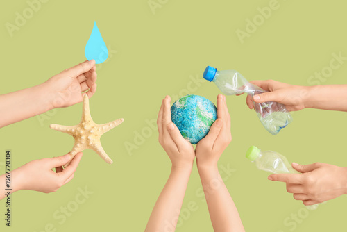 Hands holding model of Eart...