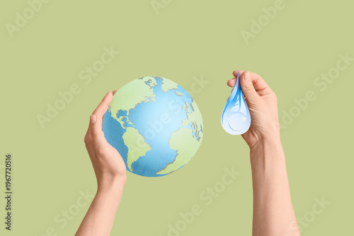 Hands holding model of Eart...