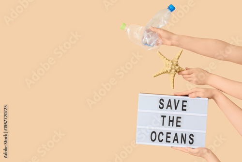 Hands holding lightbox with...