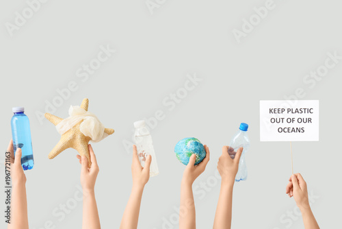 Hands holding paper sheet w...