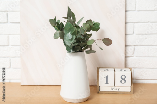 Cube calendar and vase with...