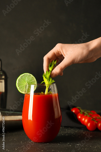 Female hand with glass of b...