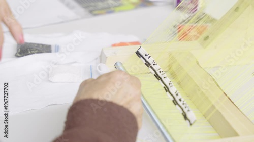 Close-up of an Artisan Using a Loom for Indigenous Bead Weaving