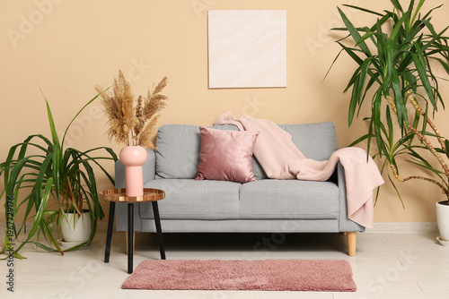 Sofa with coral cushion and...