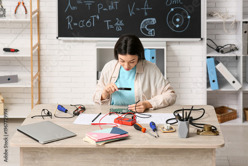 Female inventor studying co...