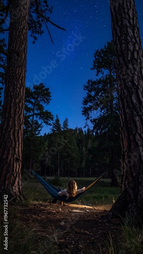 Wallpaper Mural Woman relaxing in a hammock under a starry night sky in a forest. Torontodigital.ca
