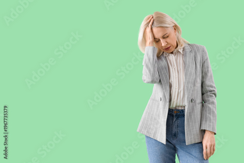 Worried mature businesswoma...