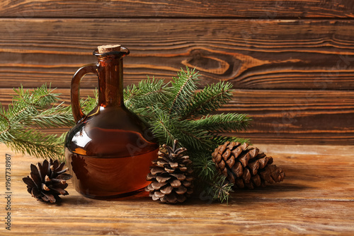 Bottle with coniferous cone...