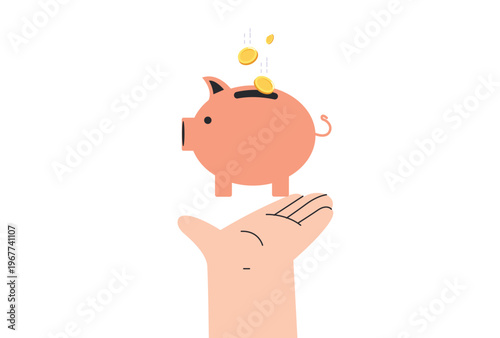 Piggy bank balancing on a human hand with golden coins falling into the slot for savings and investment concepts.