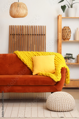 Red sofa with yellow cushio...