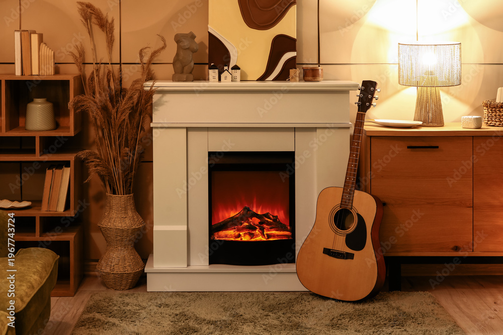 Fototapeta premium Interior of cozy living room with fireplace, guitar and commode in evening