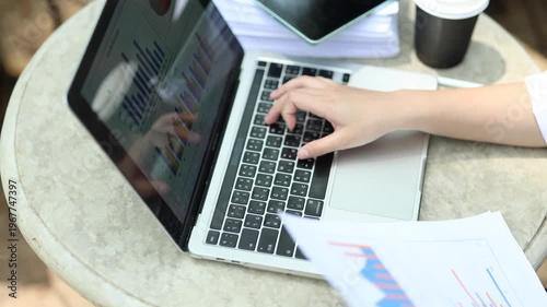Ambitious businesswoman working on laptop in modern office, collaborating with diverse team, brainstorming ideas, planning strategy, and driving innovation and career success.

