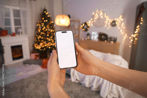 Woman with blank mobile pho...