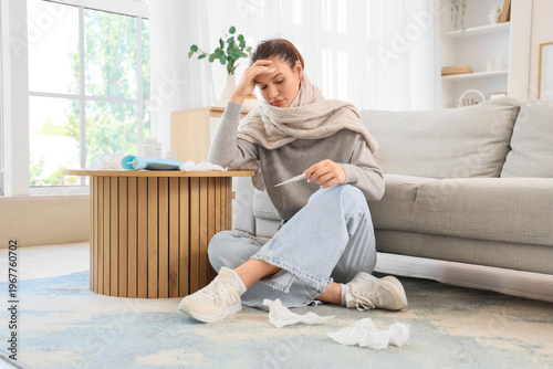 Sick young woman in scarf w...