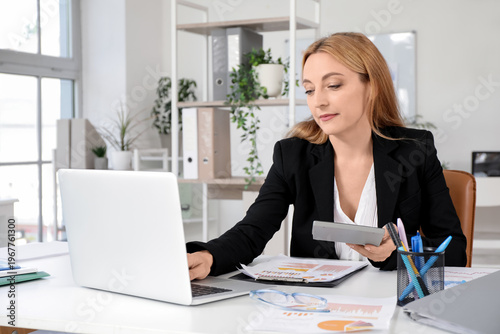 Female accountant sitting a...