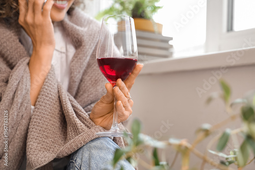 Woman with glass of wine an...