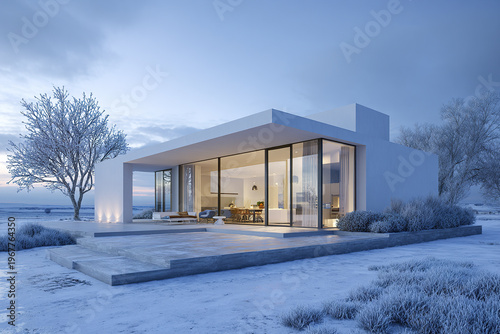 Modern white house with large glass windows in snowy winter landscape during dusk, surrounded by frosted trees and bushes, creating serene and cold atmosphere
