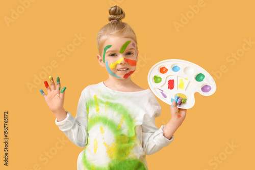 Cute little girl in paint w...