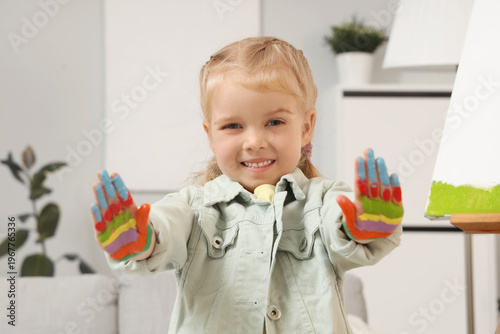 Cute little girl with her h...