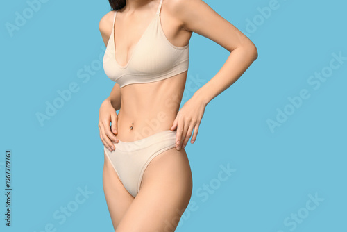 Young woman in underwear on...