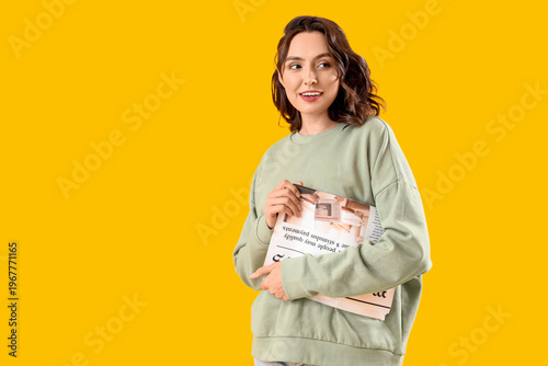 Young woman with newspaper ...