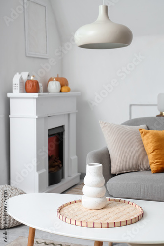 Stylish vase on table in li...