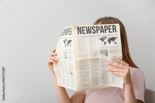 Woman reading morning newsp...