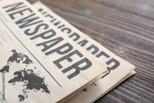 Morning newspapers on woode...