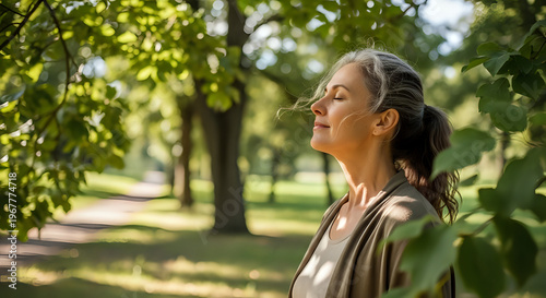 A serene woman enjoying a peaceful moment in a lush green park on a sunny day
