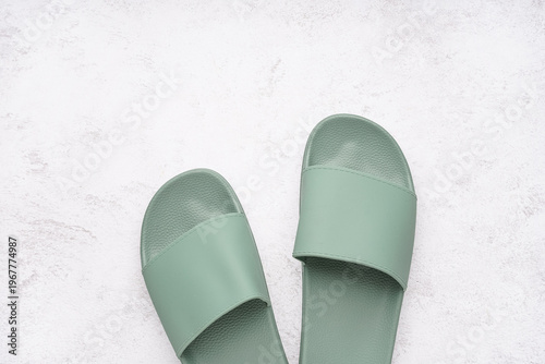 Turquoise flip-flops on whi...