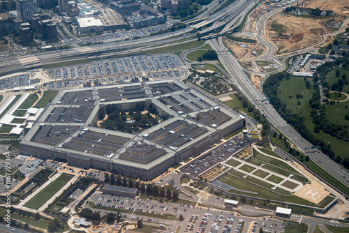 Aerial view of the Pentagon complex with surrounding roads, parking and greenery. g.