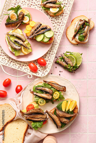 Plates of tasty sandwiches ...