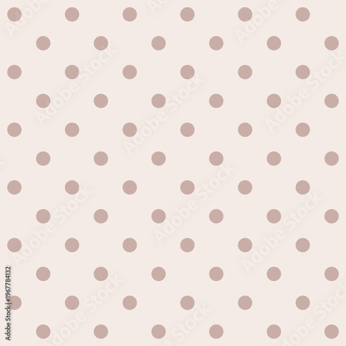 Soft pink polka dots dot a gentle beige background. Polka dots create a soothing, timeless pattern. Ideal for design, wallpaper, or baby-themed projects