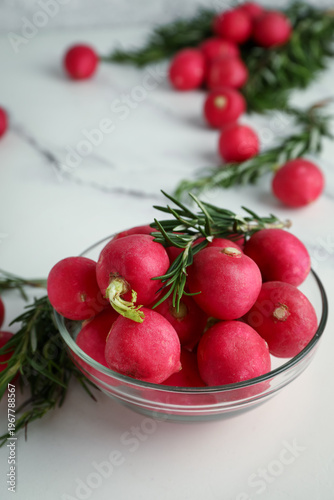 Bowl with fresh radish on l...