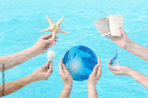 Hands holding model of Eart...