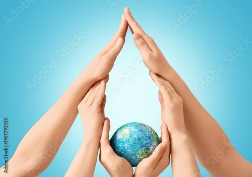 Hands with model of Earth f...