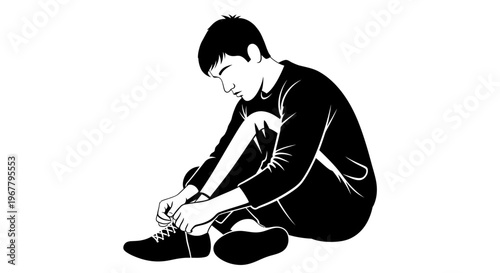 Young man tying shoelaces on his sneakers while sitting down.