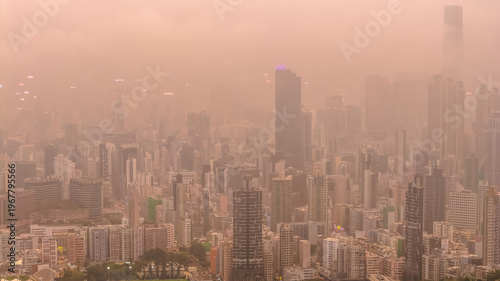 Photography March 27 2026 HONG KONG, CHINA Warm hazy skyline rising over Kowloon