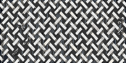 Close up of a weathered metal grate with a repeating zigzag pattern