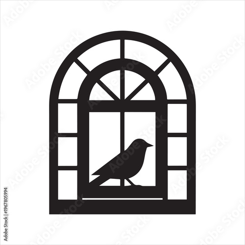 Silhouette of a bird perched on a windowsill inside an arched window