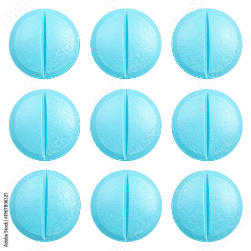 Group of nine light blue pills arranged in a grid against a black background pharmaceutical treatment in tablets healthcare concept