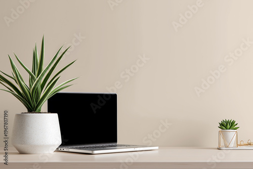 Minimal Laptop Desk Setup with Plants on Beige Background