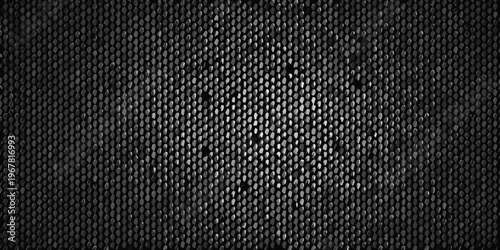 Close up of a dark textured surface resembling reptile skin