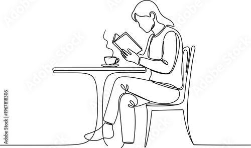 Woman sitting at table reading book.