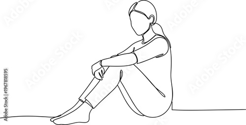 Woman sitting on the floor alone.