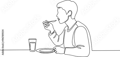 Man eating with fork and knife.