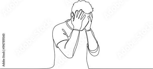 Man covering face with hands stressed.