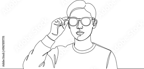 Young man wearing glasses and cap.