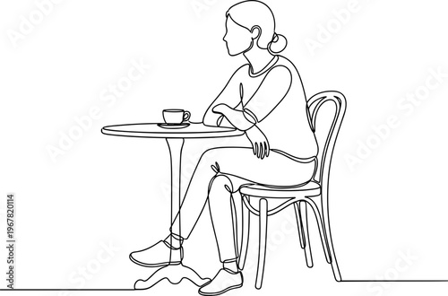 Woman Sitting Alone at Small Table.