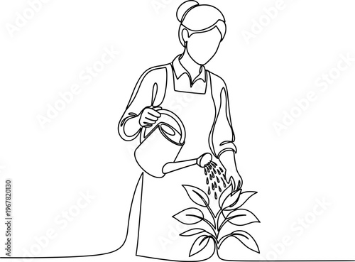 Woman watering a young plant.